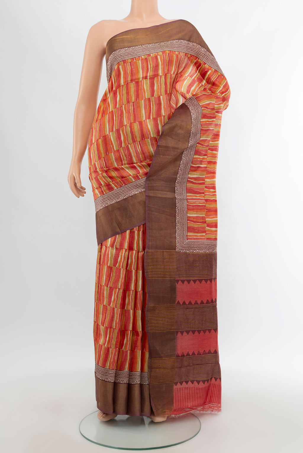 Multi Color Tussar Silk Saree with Printed design on the body and Zari Border.  displayed on a mannequin