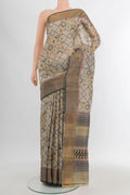 Grey Tussar Silk Saree with Floral Print on the body and Zari Border.  displayed on a mannequin