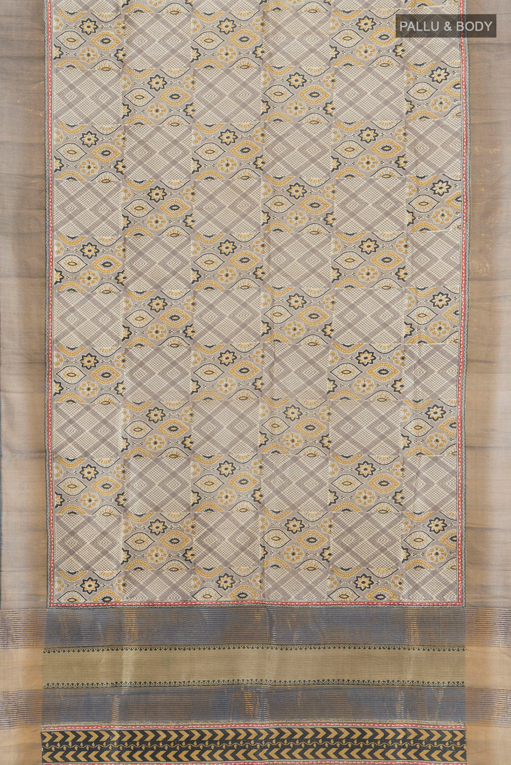 Flat view of Grey Tussar Silk Saree with Floral Print on the body and Zari Border. 