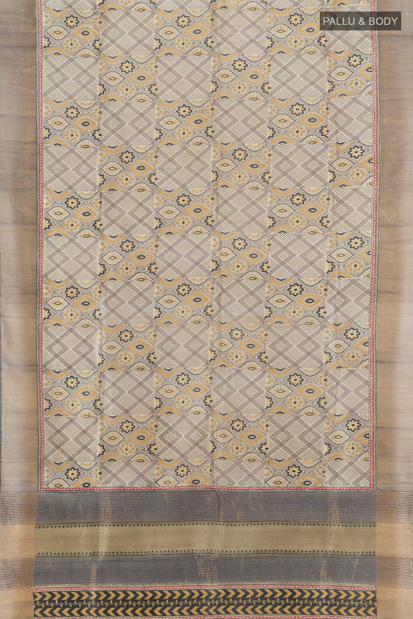 Flat view of Grey Tussar Silk Saree with Floral Print on the body and Zari Border. 