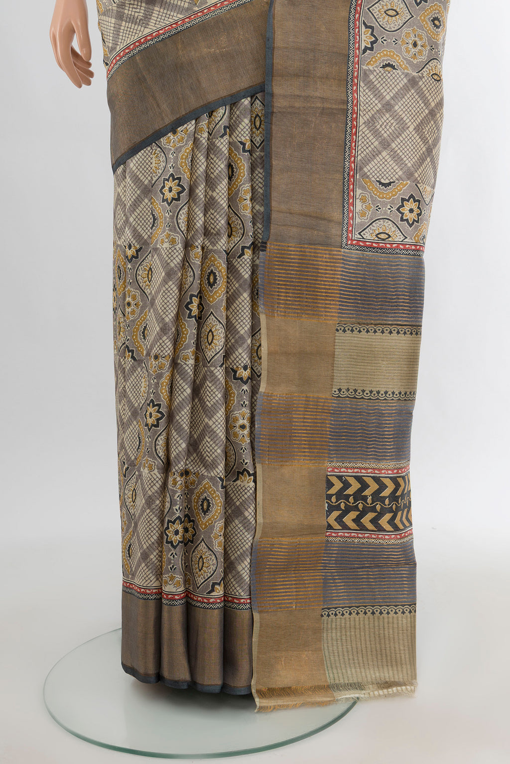 Pleats and pallu of Grey Tussar Silk Saree with Floral Print on the body and Zari Border. 