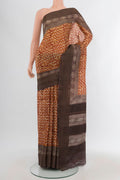 Mustard Tussar Silk Saree with Floral Print on the body and Printed Border.  displayed on a mannequin