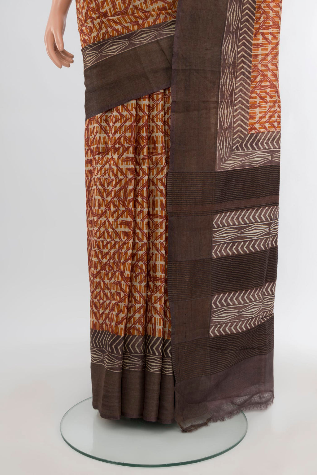 Pleats and pallu of Mustard Tussar Silk Saree with Floral Print on the body and Printed Border. 