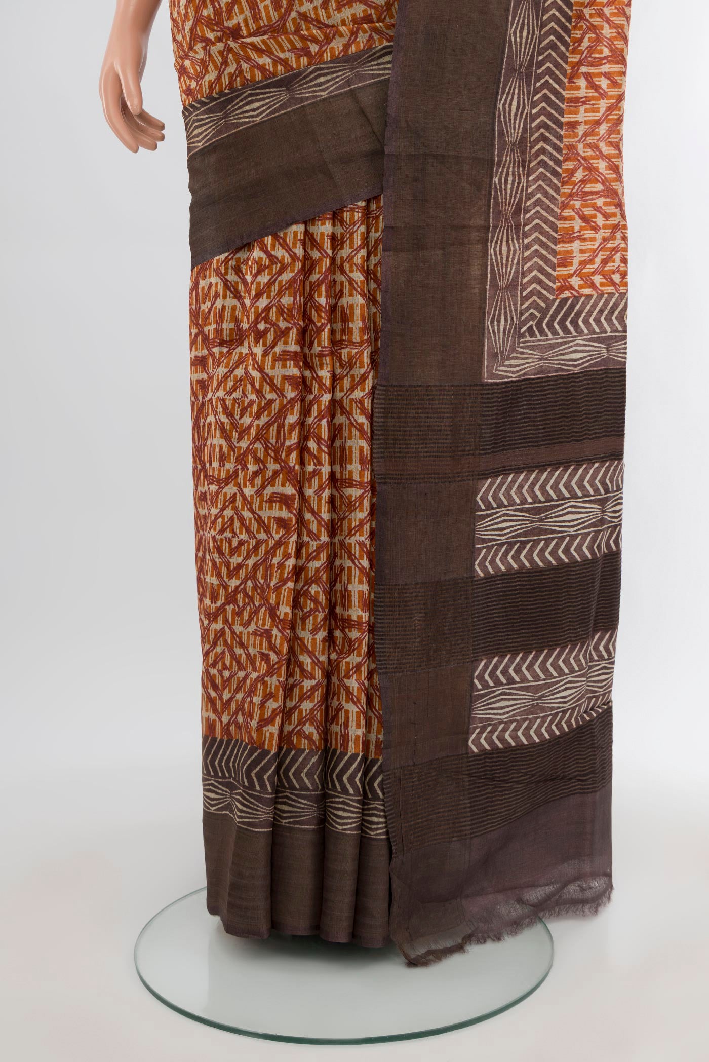 Pleats and pallu of Mustard Tussar Silk Saree with Floral Print on the body and Printed Border. 