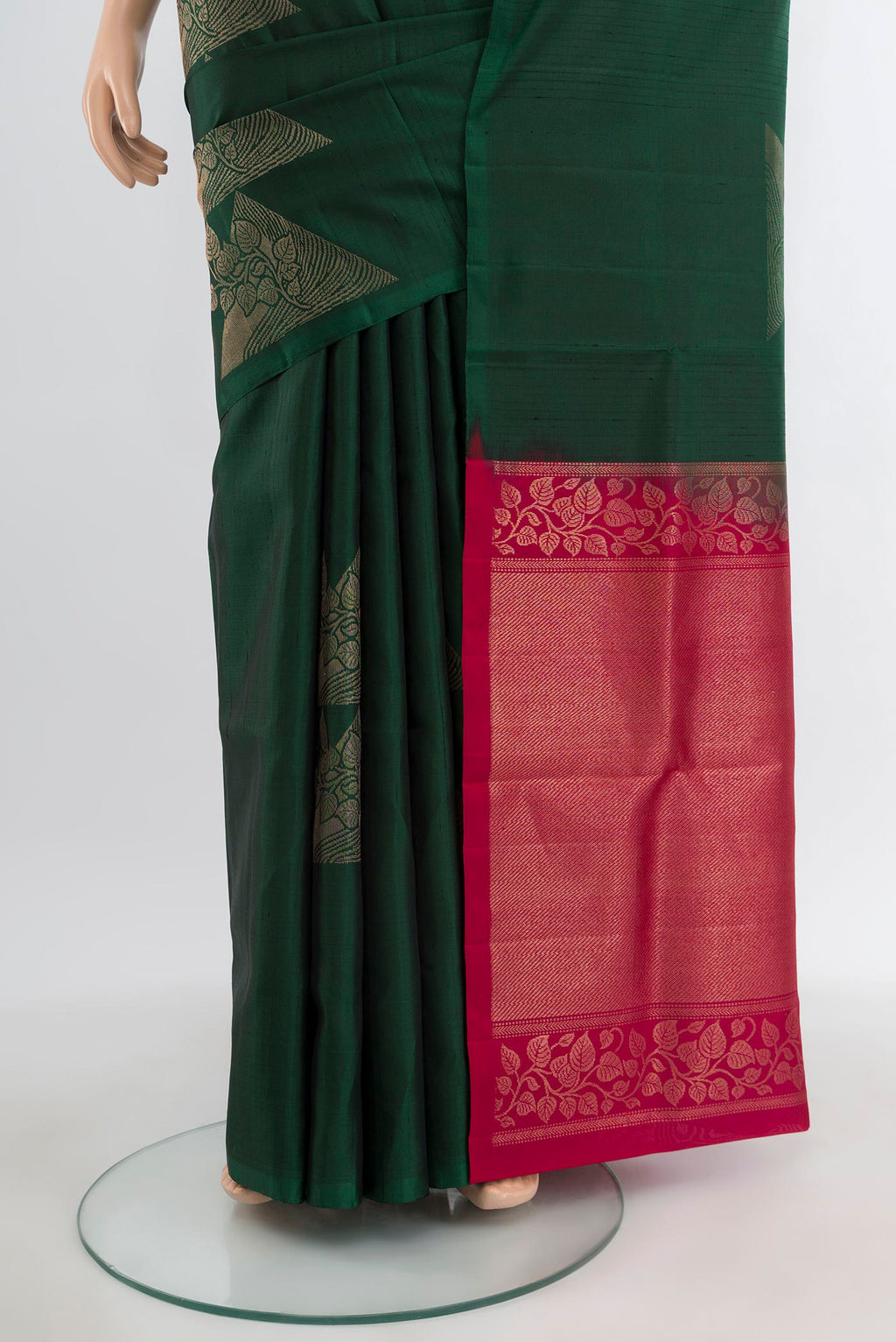 Pleats and pallu of Bottle Green Soft Silk Saree with Zari Butta on the body and Without Border. 