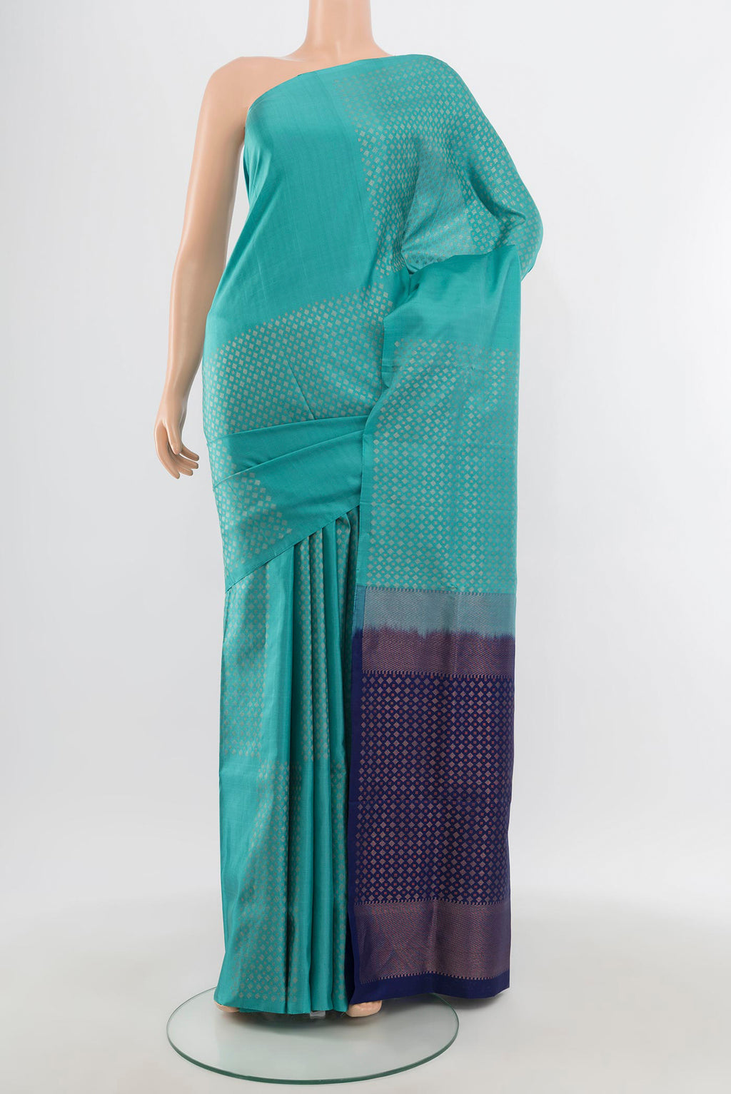 Sky Blue Soft Silk Saree with Zari Butta on the body and Without Border.  displayed on a mannequin
