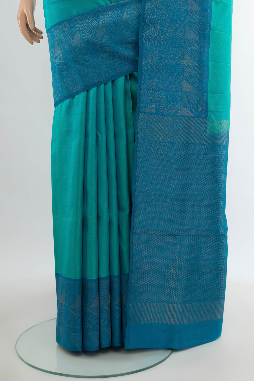 Pleats and pallu of Turquoise Soft Silk Saree with Plain Body and Fancy Border. 