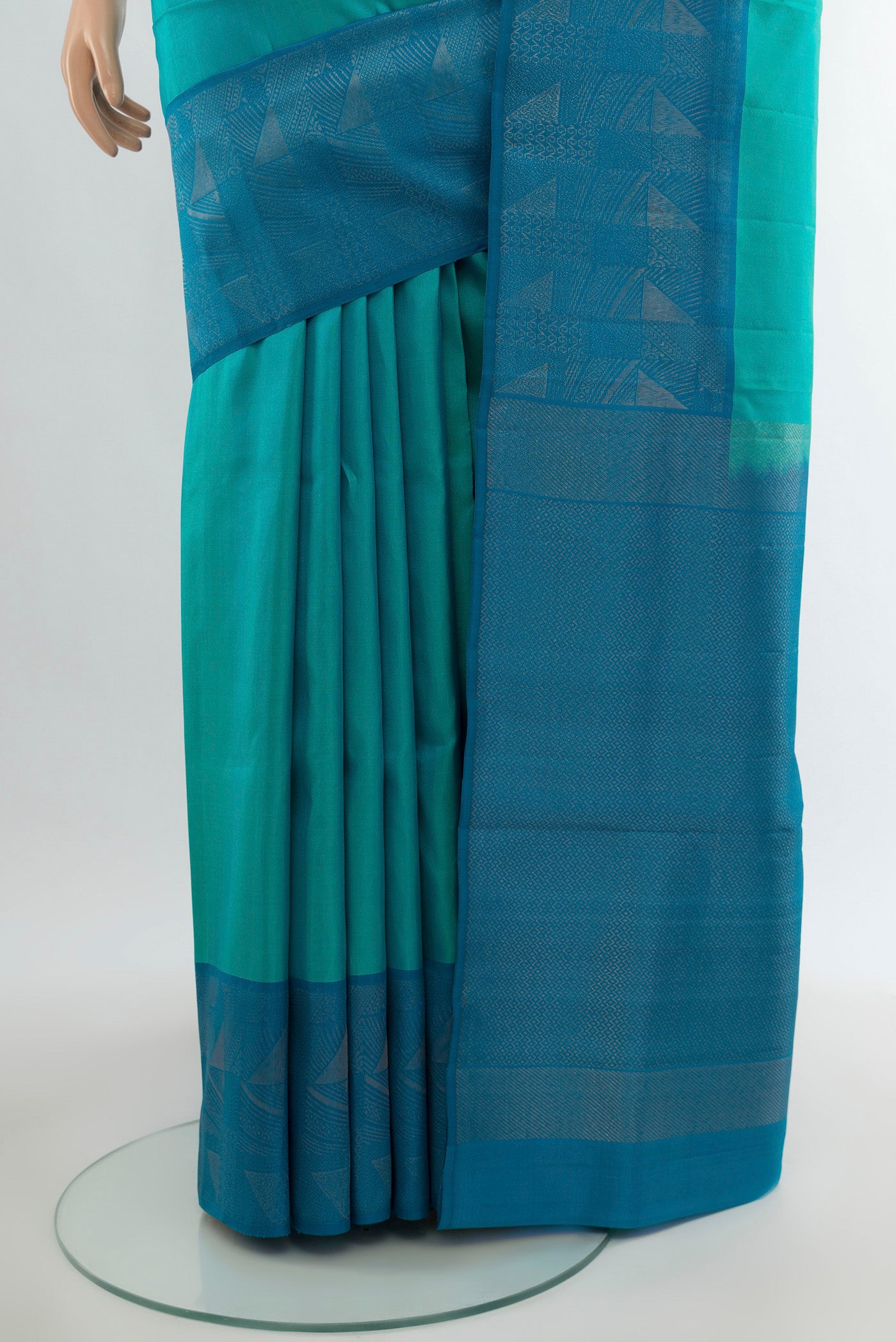 Pleats and pallu of Turquoise Soft Silk Saree with Plain Body and Fancy Border. 