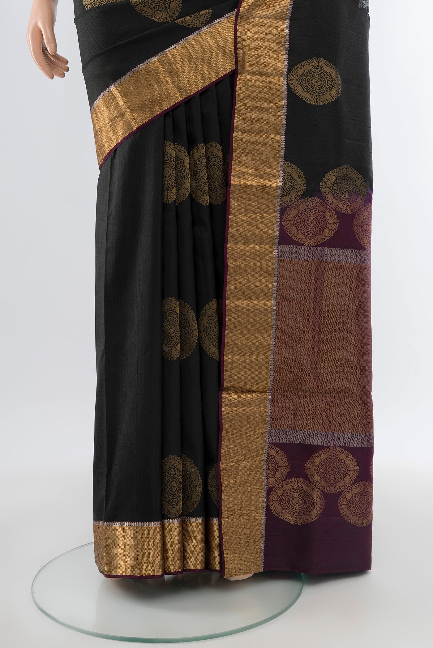 Pleats and pallu of Pure Silk Pure Zari Black Soft Saree with Zari Butta on the body and Silk Border. 