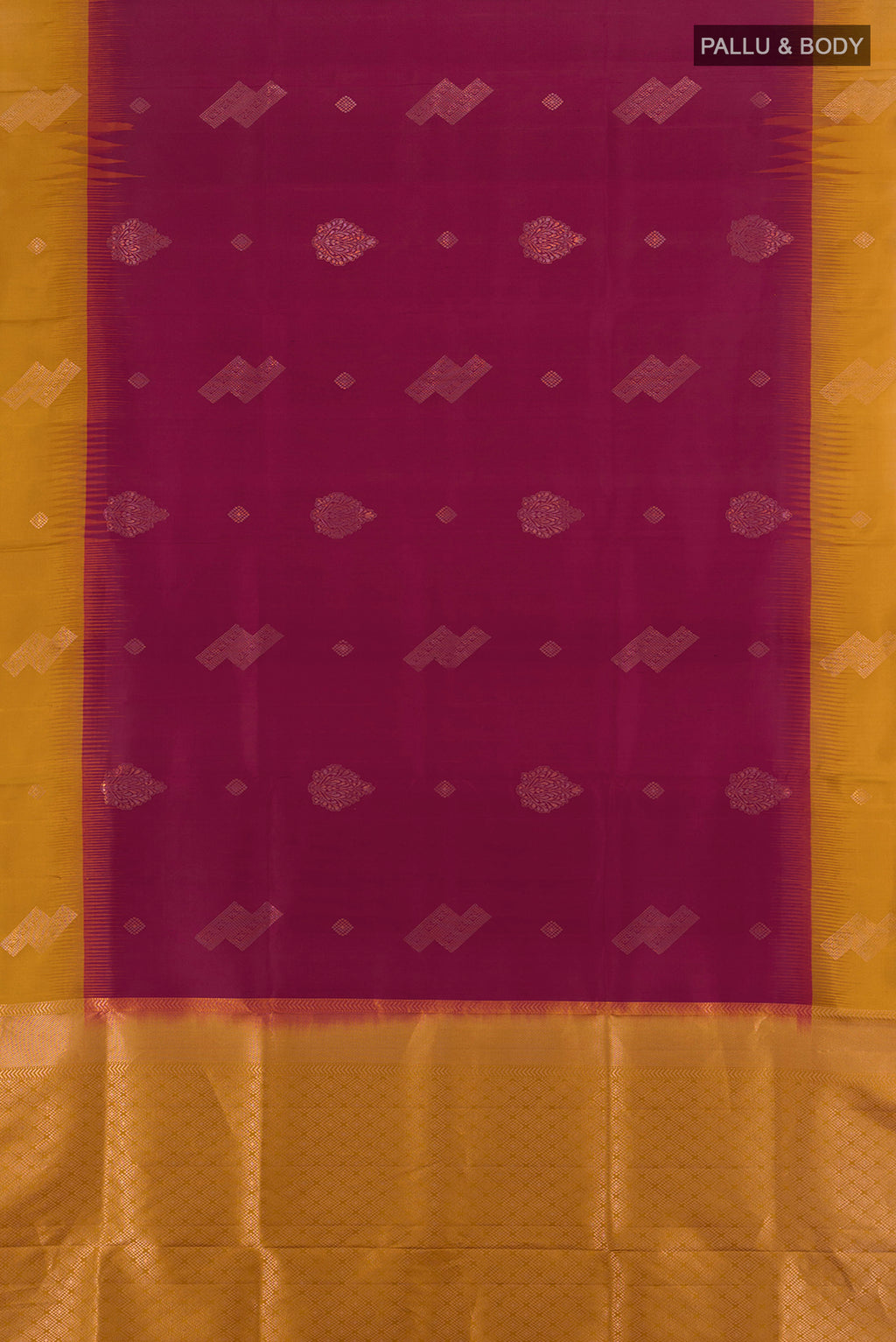 Flat view of Maroon Soft Silk Saree with Zari Butta on the body and Plain Border. 