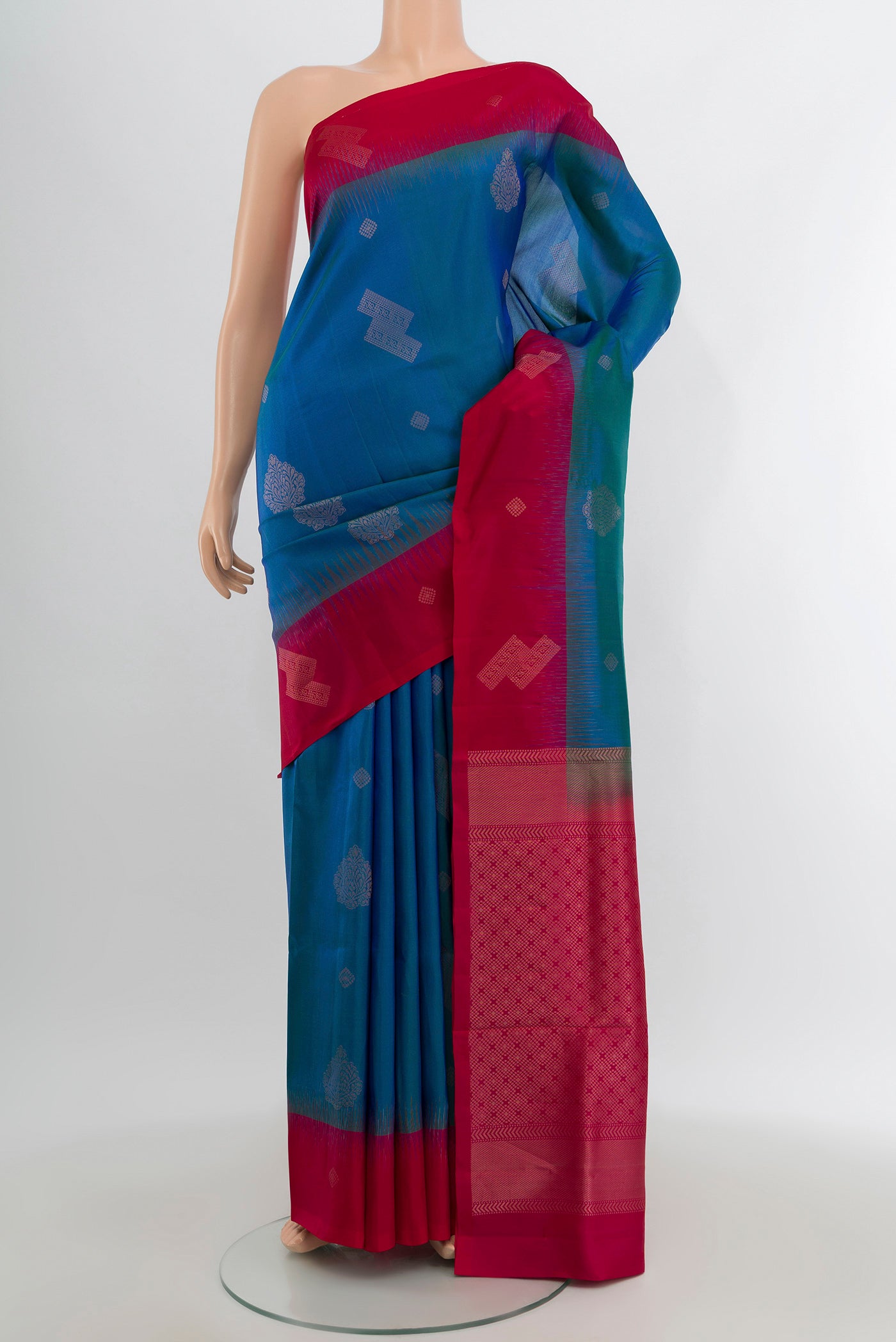 Blue Soft Silk Saree with Zari Butta on the body and Zari Border.  displayed on a mannequin