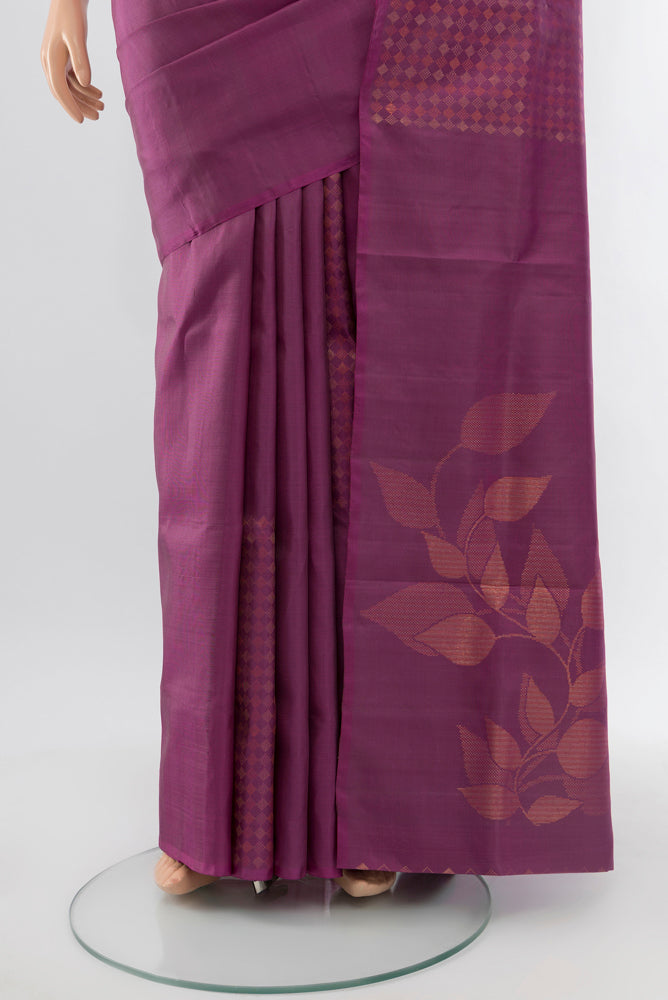 Pleats and pallu of Bronze Soft Silk Saree with Zari Butta on the body and Silk Border. 