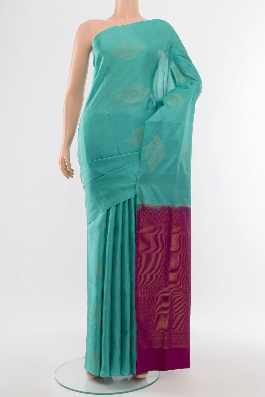 Sky Blue Soft Silk Saree with Zari Butta on the body and Silk Border.  displayed on a mannequin