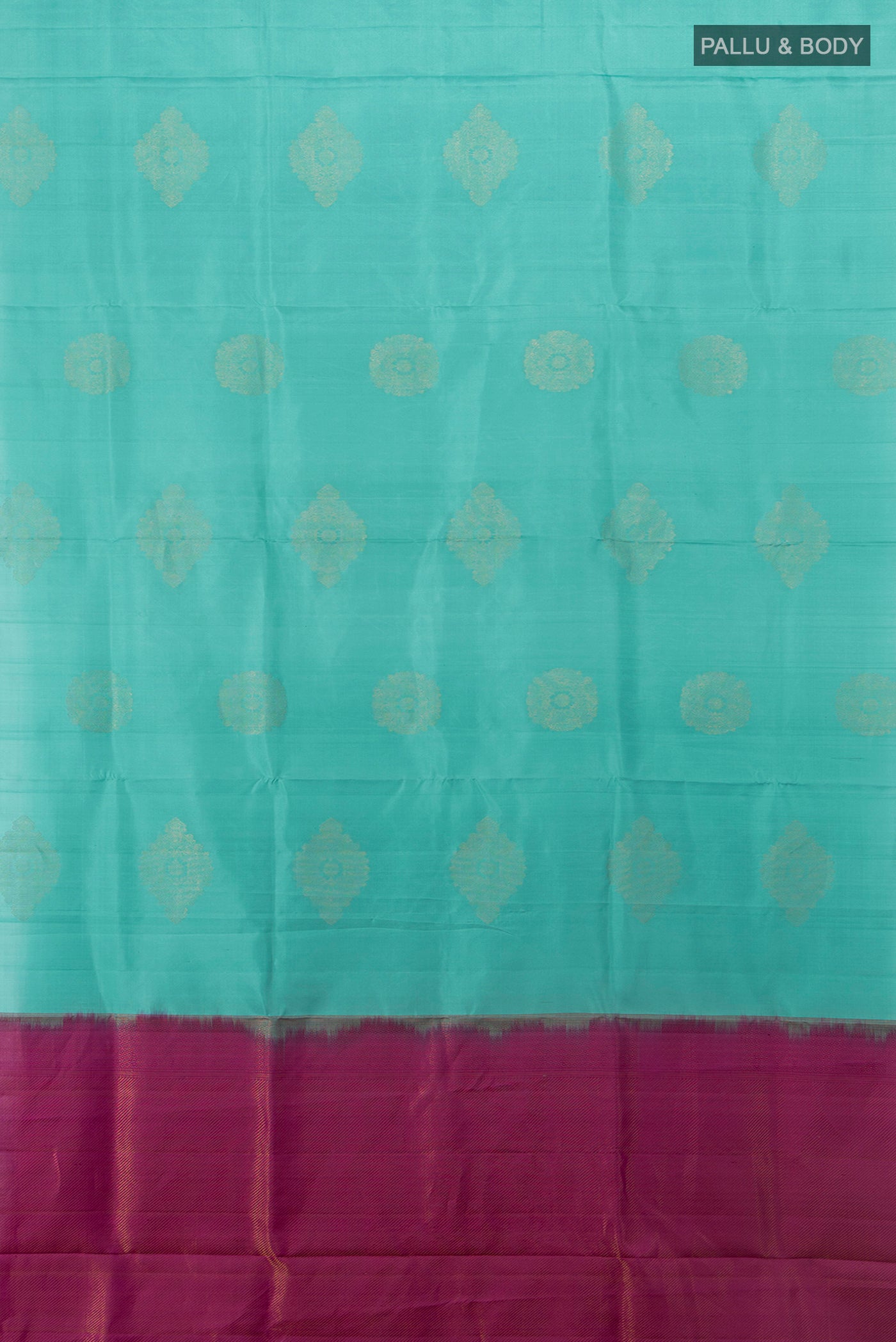 Flat view of Sky Blue Soft Silk Saree with Zari Butta on the body and Silk Border. 