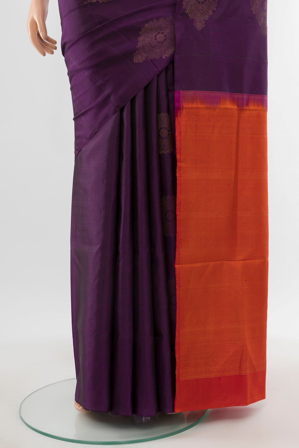 Pleats and pallu of Violet Soft Silk Saree with Zari Butta on the body and Silk Border. 