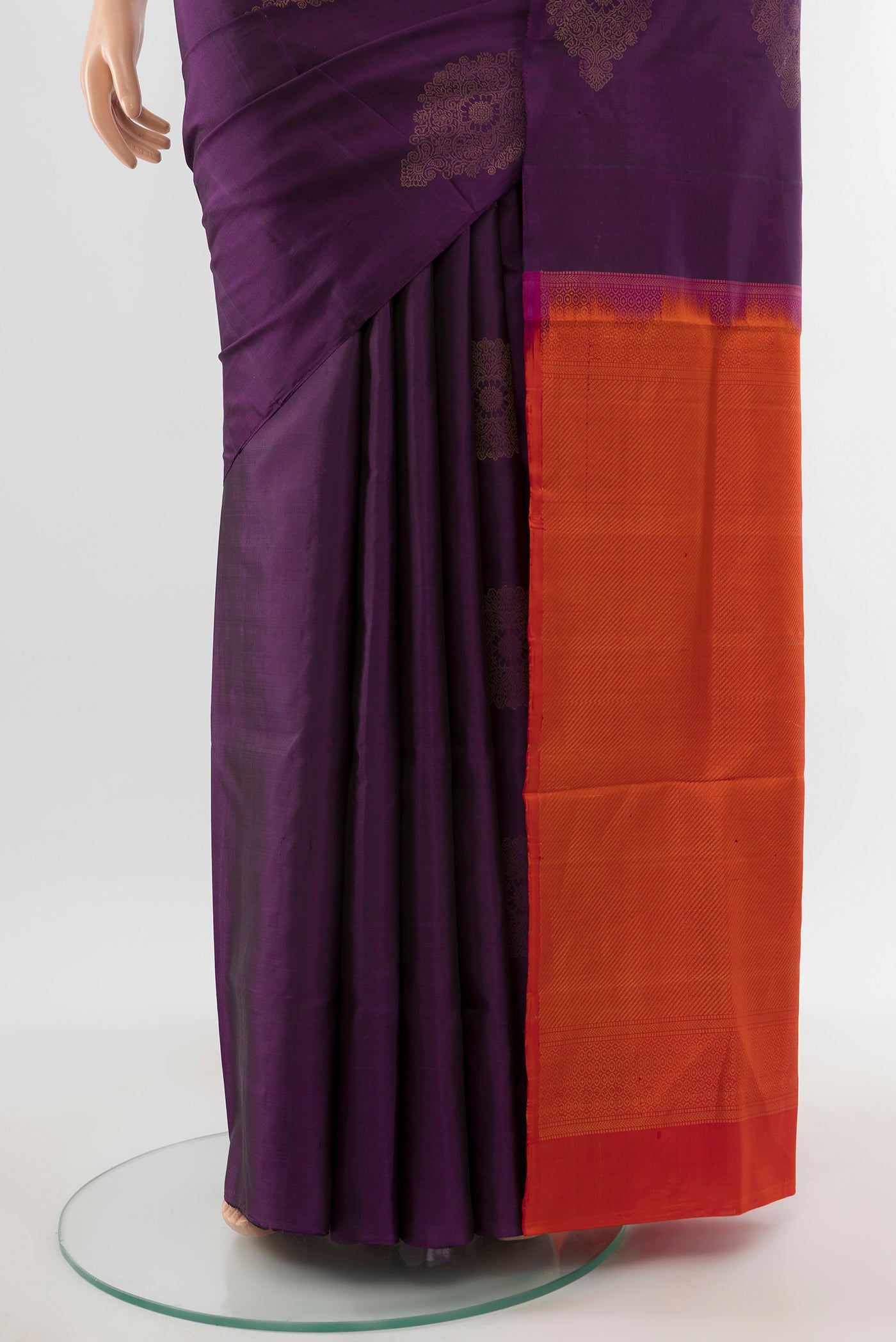 Pleats and pallu of Violet Soft Silk Saree with Zari Butta on the body and Silk Border. 