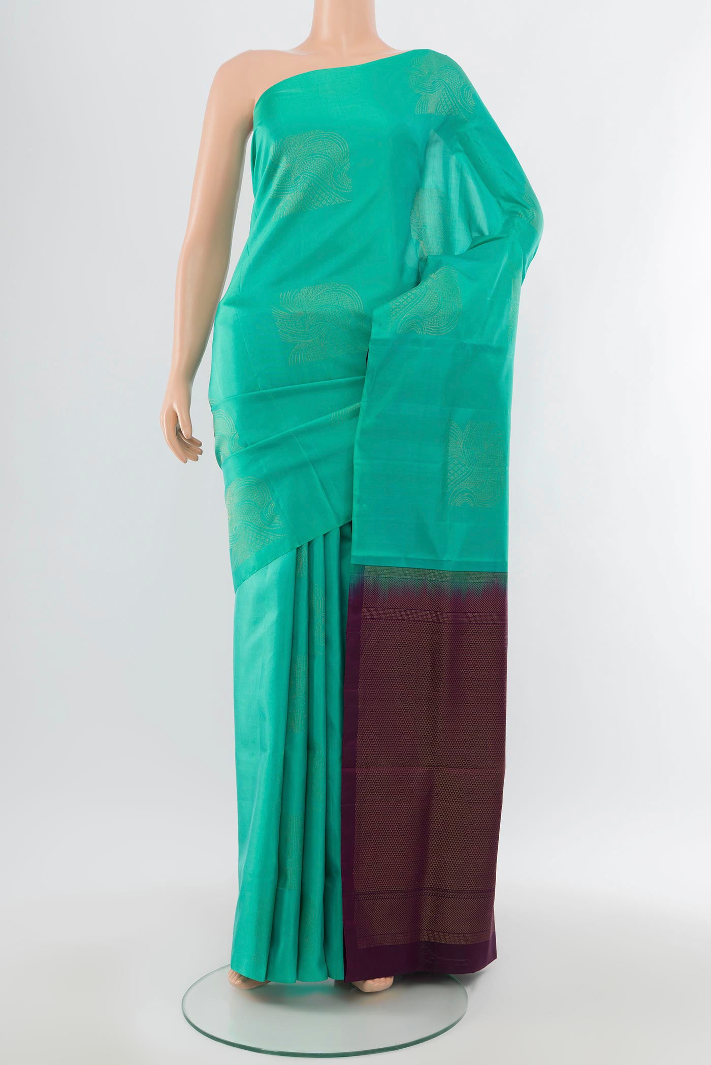 Sky Blue Soft Silk Saree with Zari Butta on the body and Silk Border.  displayed on a mannequin