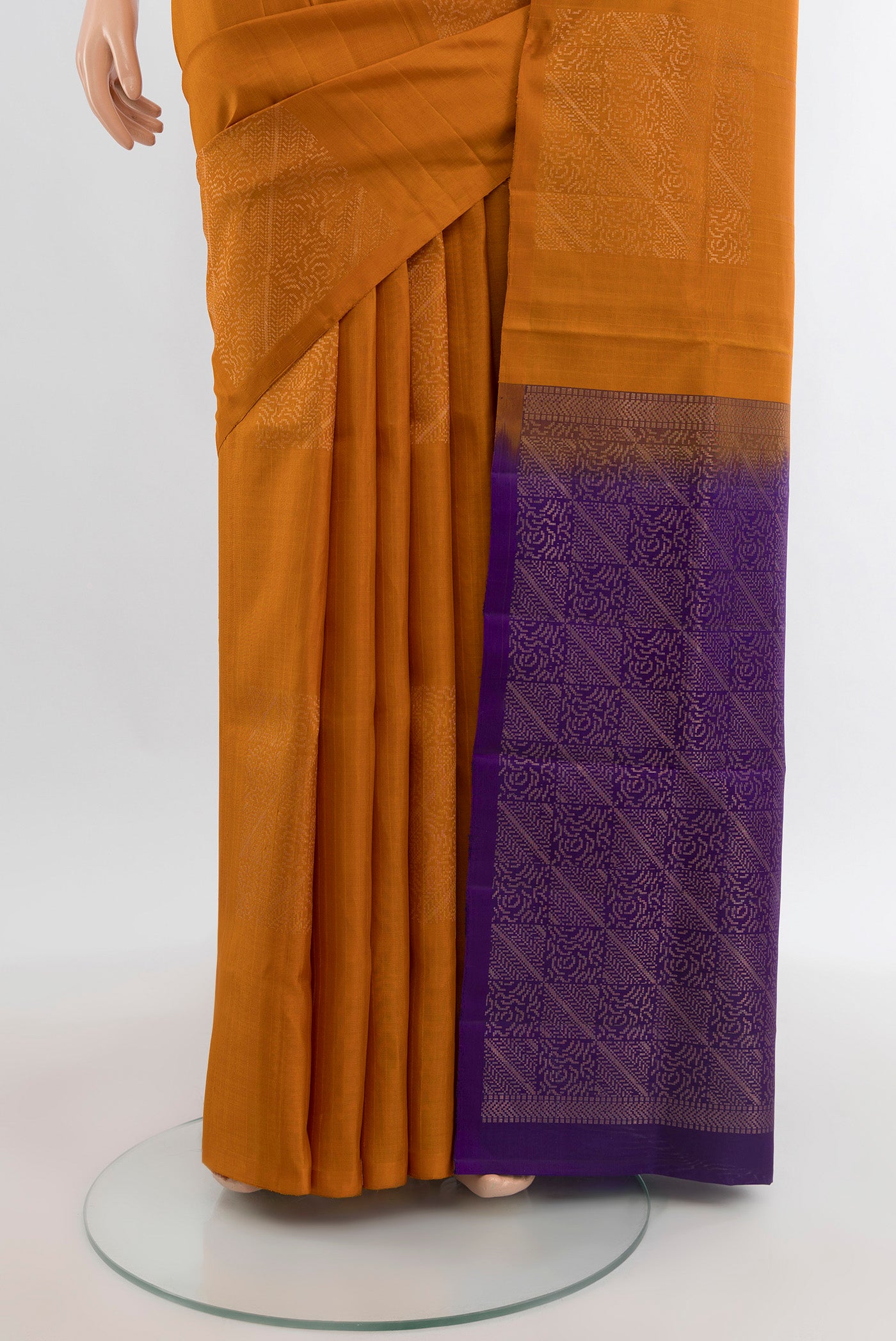 Pleats and pallu of Brick Orange Soft Silk Saree with Zari Butta on the body and Without Border. 