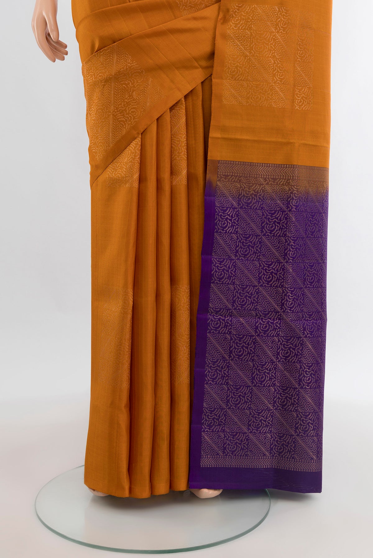 Pleats and pallu of Brick Orange Soft Silk Saree with Zari Butta on the body and Without Border. 
