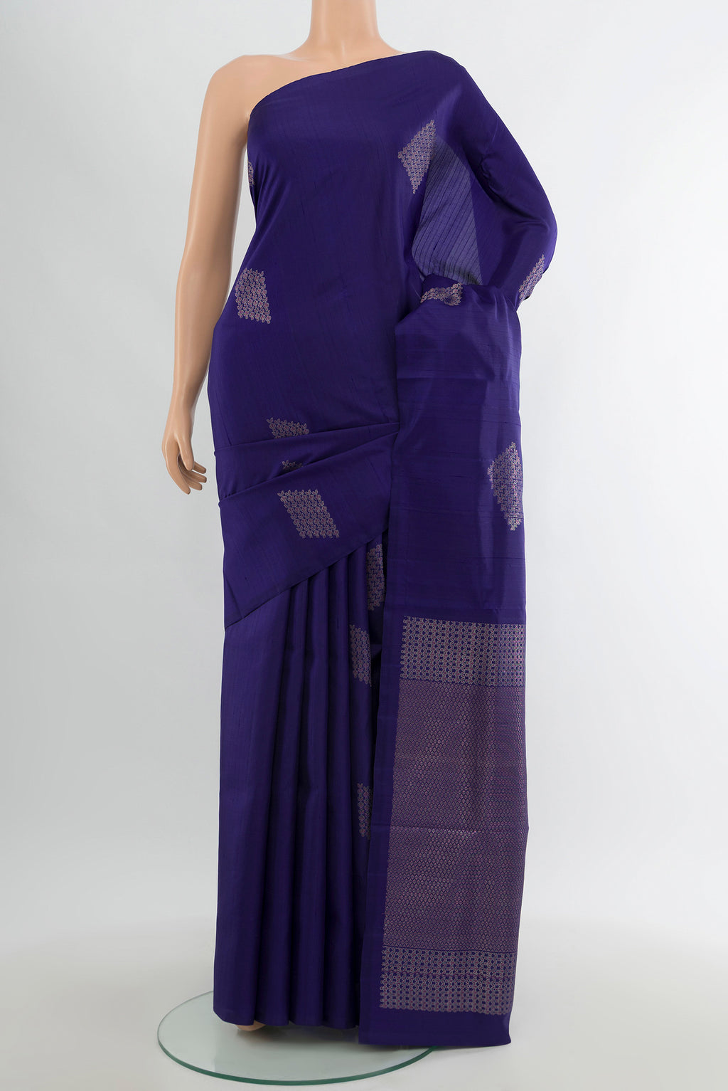 Dark Blue Soft Silk Saree with Zari Butta on the body and Without Border.  displayed on a mannequin