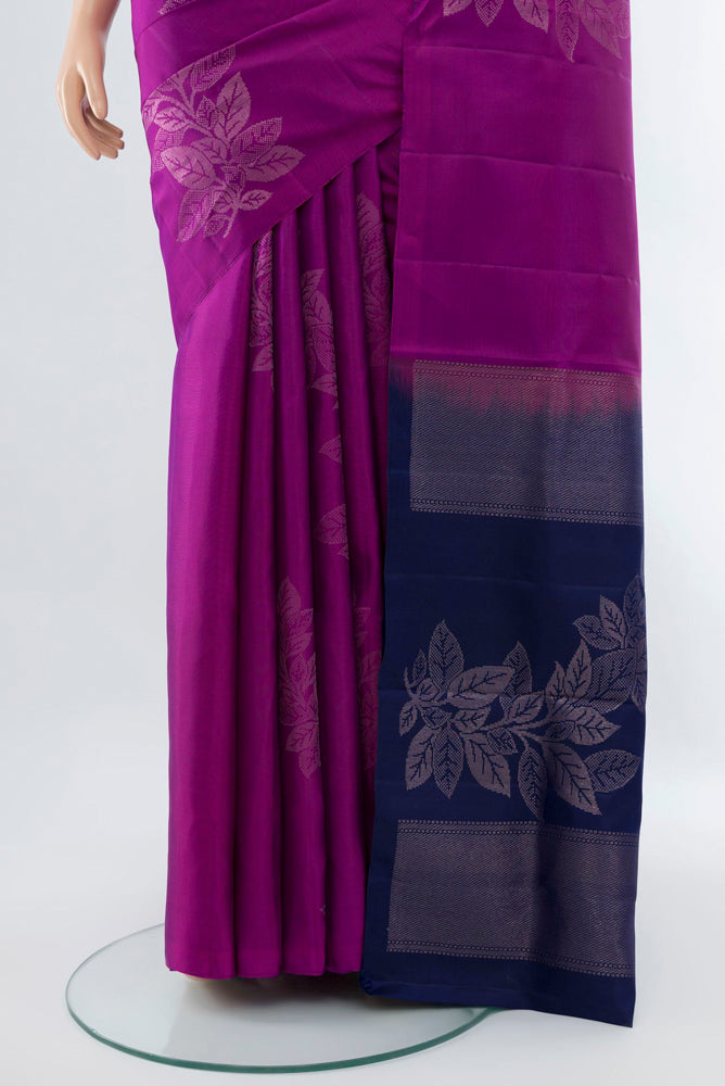 Pleats and pallu of Purple Soft Silk Saree with Zari Butta on the body and Silk Border. 
