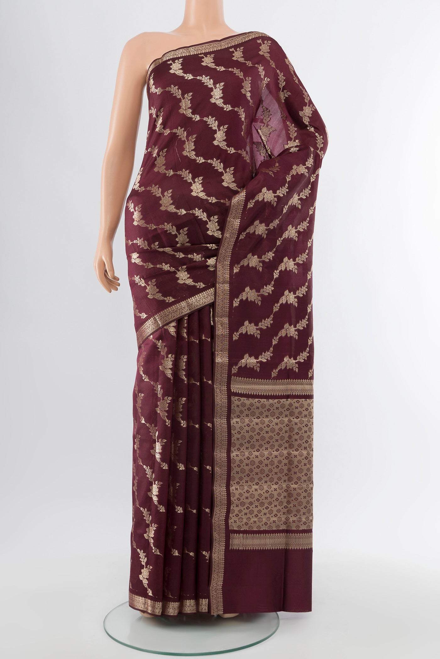 Coffee Brown Banarasi Raw Silk Saree with Zari Butta on the body and Silk Border.  displayed on a mannequin