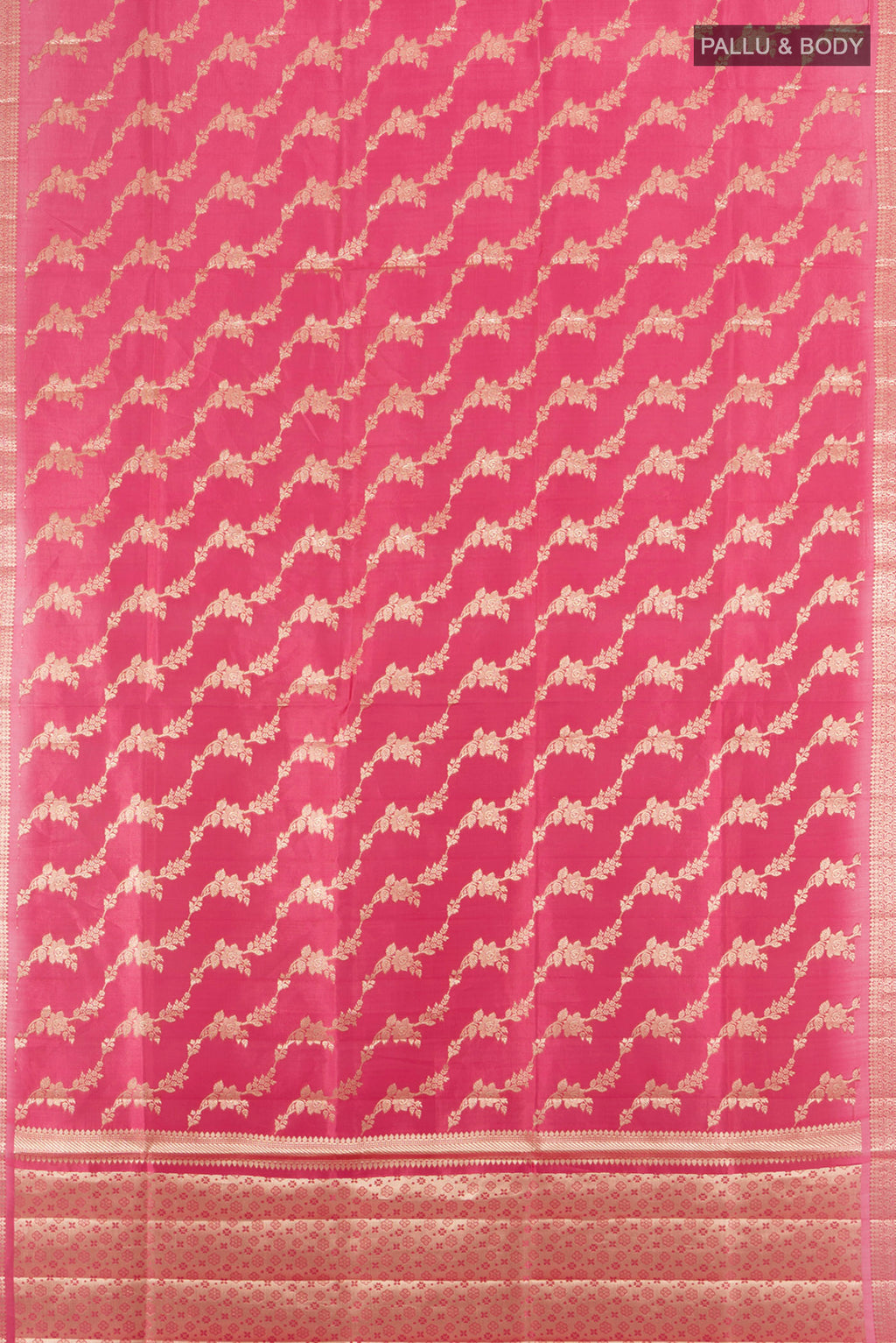 Flat view of Rose Gold Banarasi Raw Silk Saree with Zari Butta on the body and Silk Border. 