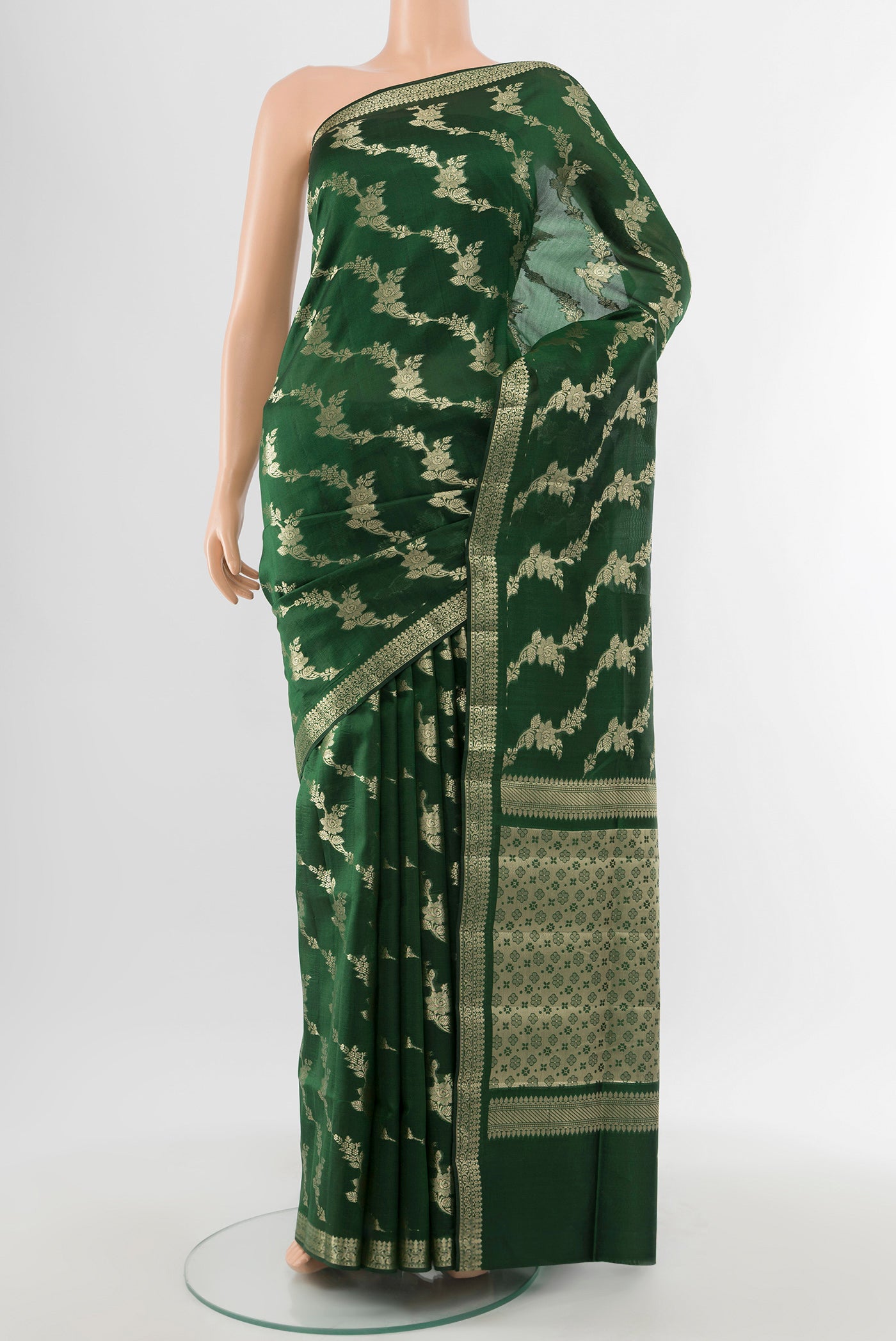 Pure Silk Pure Zari Bottle Green Banarasi Raw Saree with Zari Butta on the body and Silk Border.  displayed on a mannequin