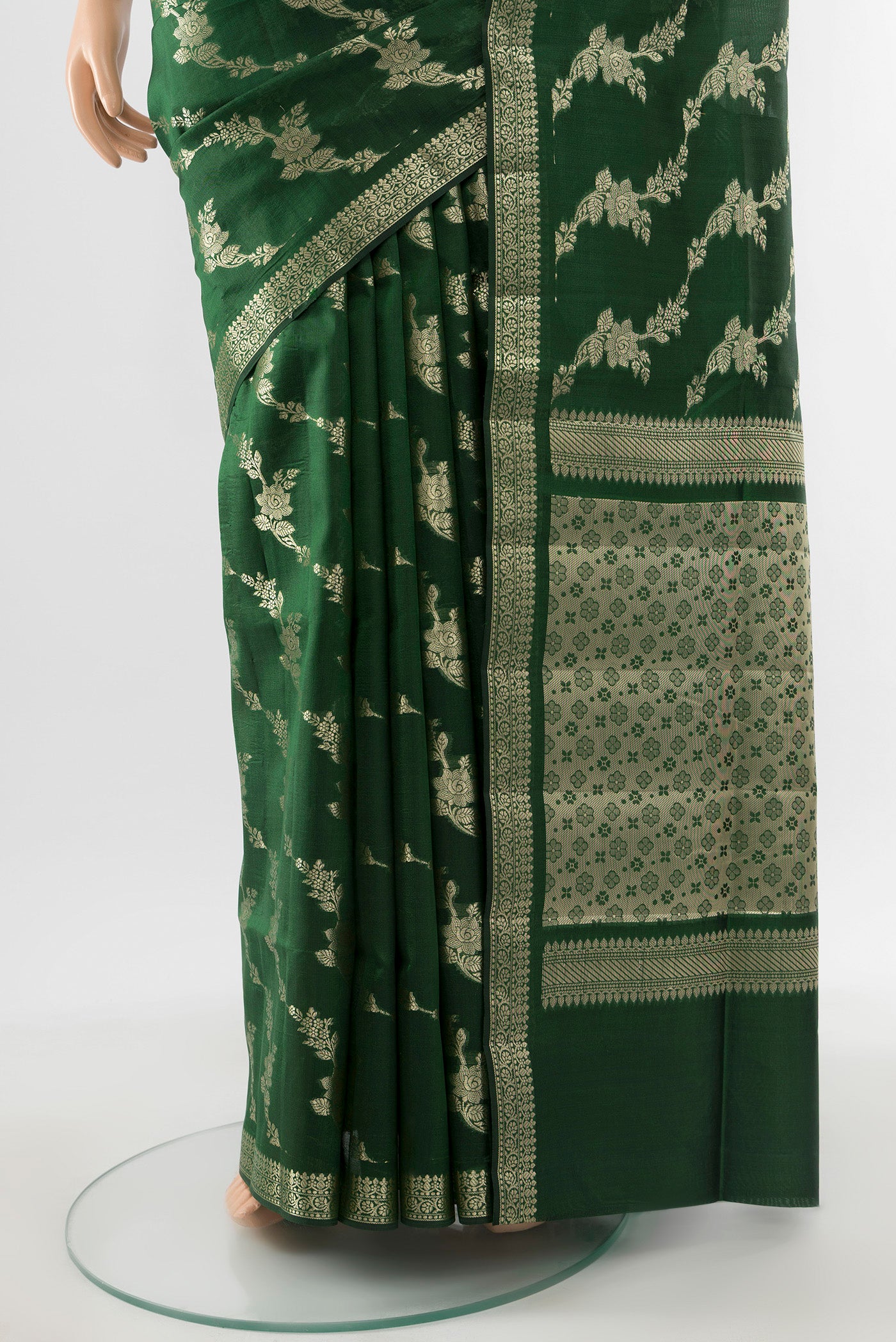 Pleats and pallu of Pure Silk Pure Zari Bottle Green Banarasi Raw Saree with Zari Butta on the body and Silk Border. 