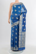 Light Blue Banarasi Raw Silk Saree with Zari Butta on the body and Silk Border.  displayed on a mannequin