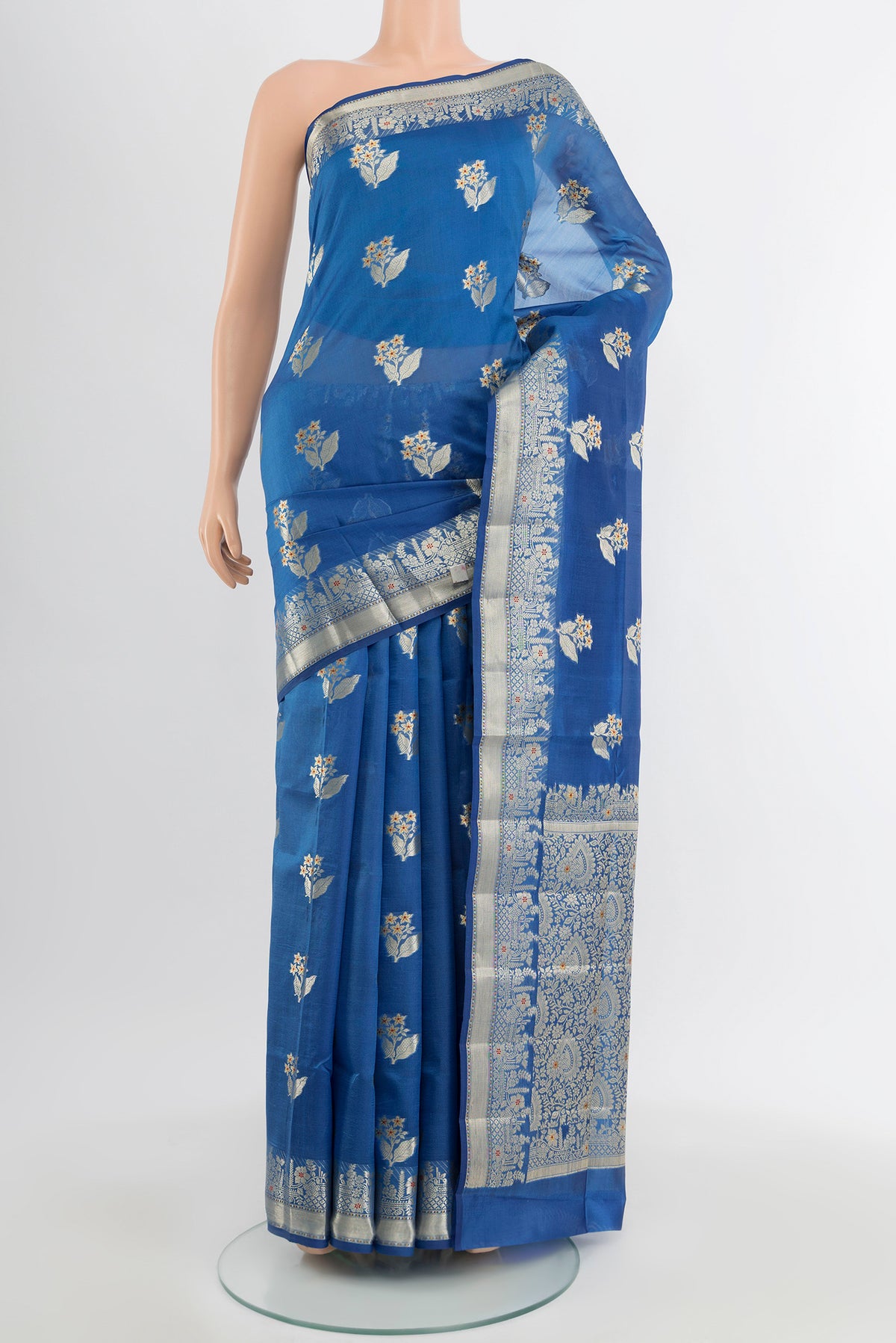 Light Blue Banarasi Raw Silk Saree with Zari Butta on the body and Silk Border.  displayed on a mannequin