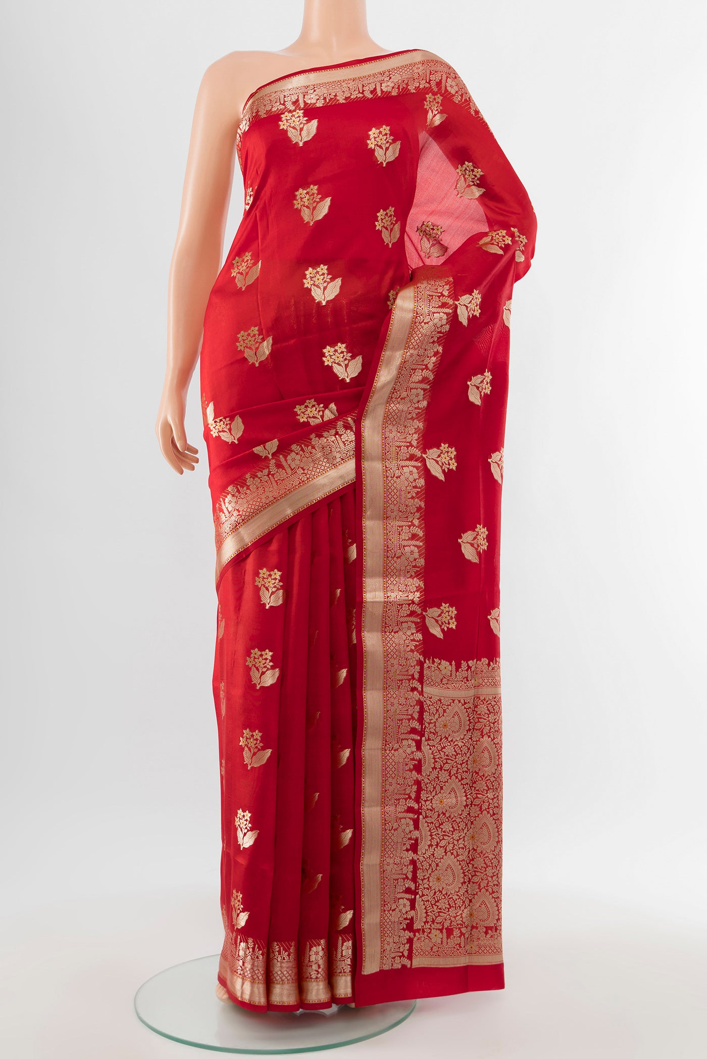 Pure Silk Pure Zari Red Banarasi Raw Saree with Zari Butta on the body and Silk Border.  displayed on a mannequin