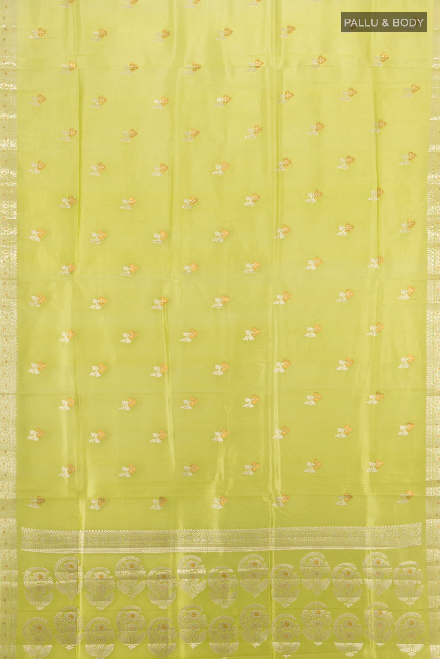 Flat view of Pista Green Banarasi Raw Silk Saree with Zari Butta on the body and Silk Border. 