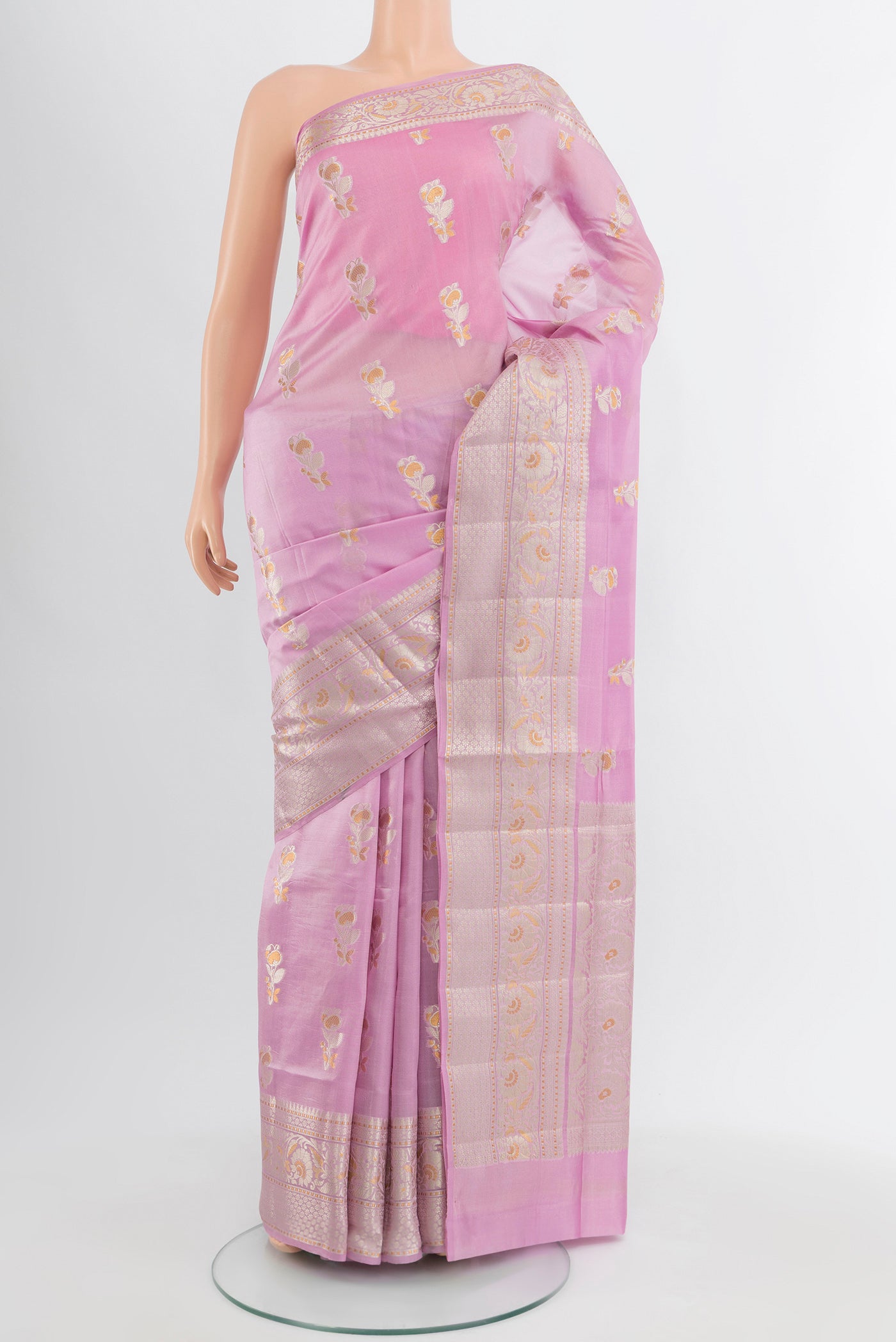 Lavender Banarasi Raw Silk Saree with Zari Butta on the body and Silk Border.  displayed on a mannequin