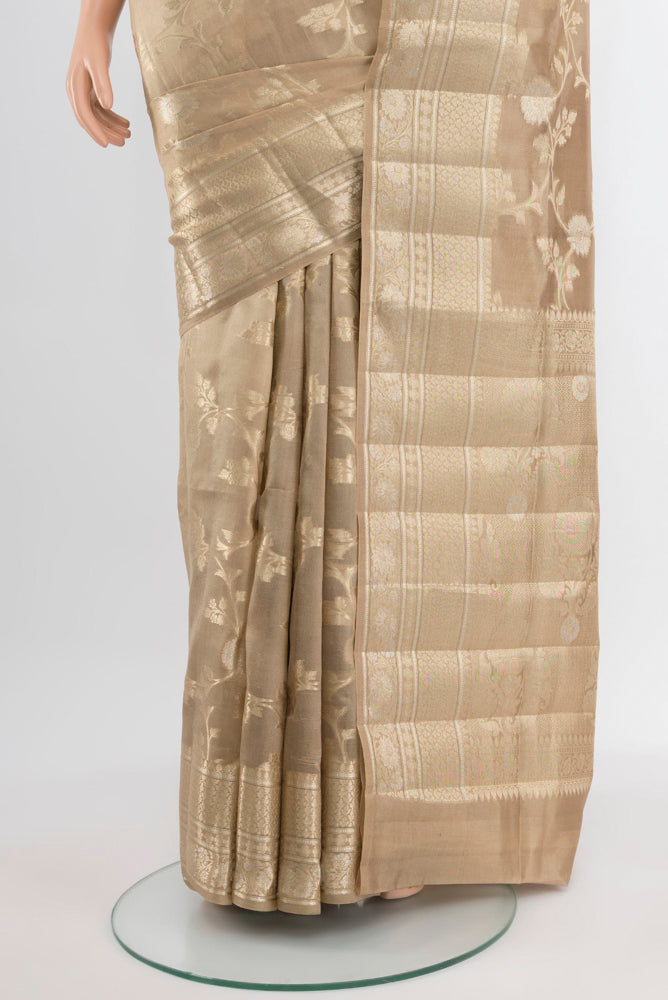 Pleats and pallu of Dark Beige Banarasi Raw Silk Saree with Zari Butta on the body and Silk Border. 