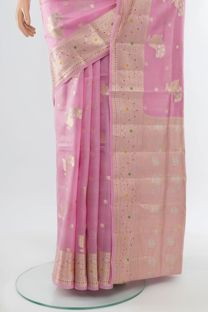 Pleats and pallu of Rose Gold Banarasi Raw Silk Saree with Zari Butta on the body and Silk Border. 