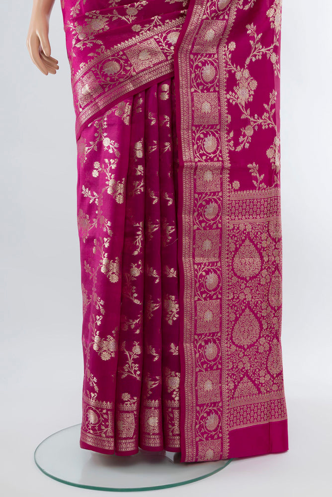 Pleats and pallu of Magenta Banarasi Raw Silk Saree with Zari Butta on the body and Silk Border. 