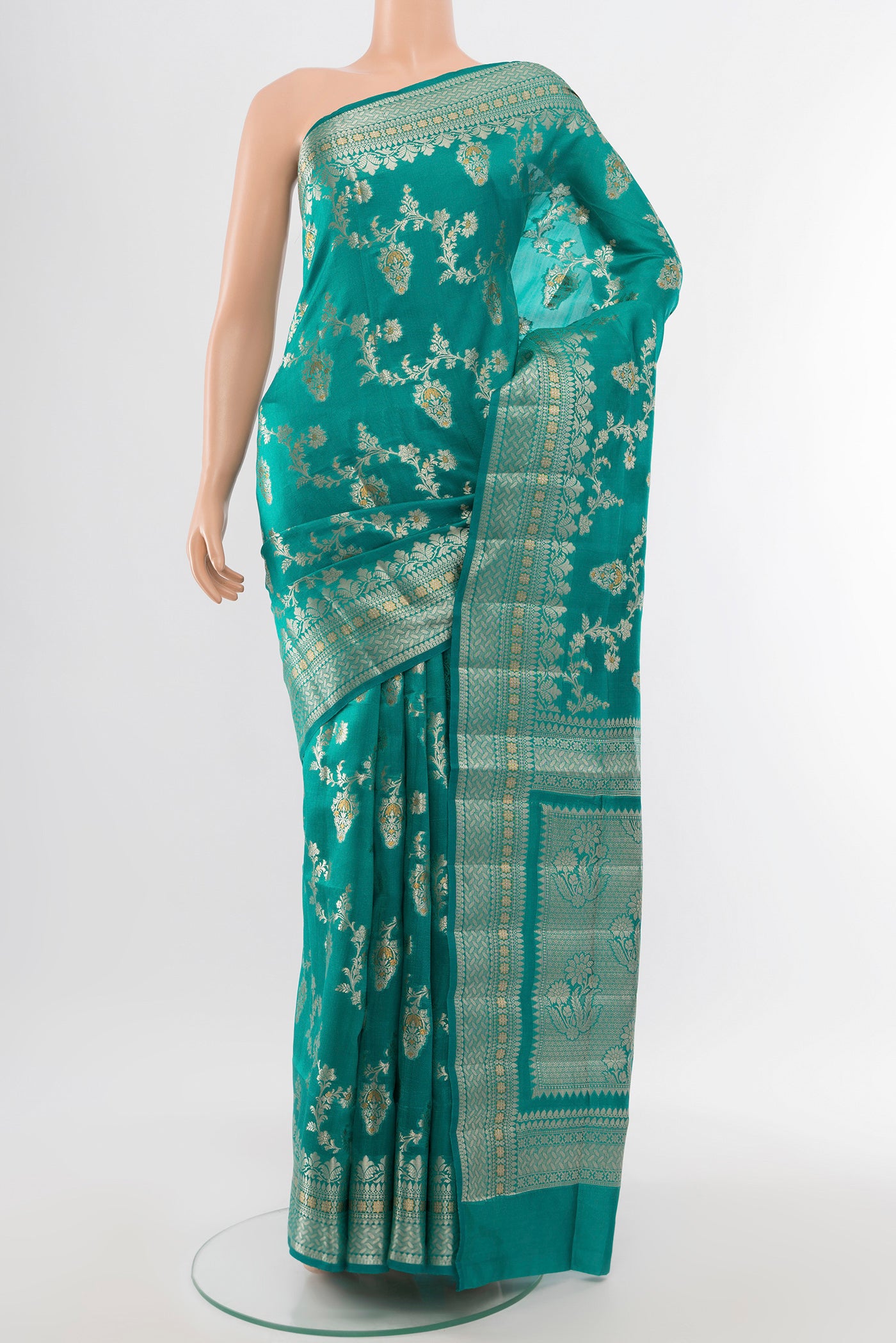 Light Blue Banarasi Raw Silk Saree with Zari Butta on the body and Silk Border.  displayed on a mannequin