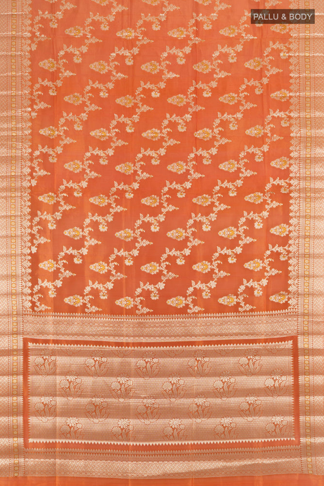Flat view of Rust Banarasi Raw Silk Saree with Zari Butta on the body and Silk Border. 