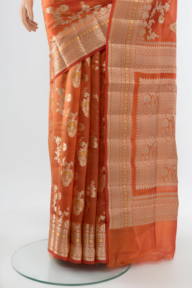 Pleats and pallu of Rust Banarasi Raw Silk Saree with Zari Butta on the body and Silk Border. 