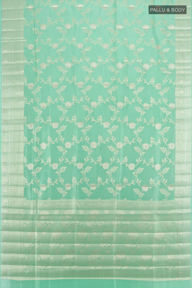 Flat view of Light Green Banarasi Raw Silk Saree with Zari Butta on the body and Silk Border. 