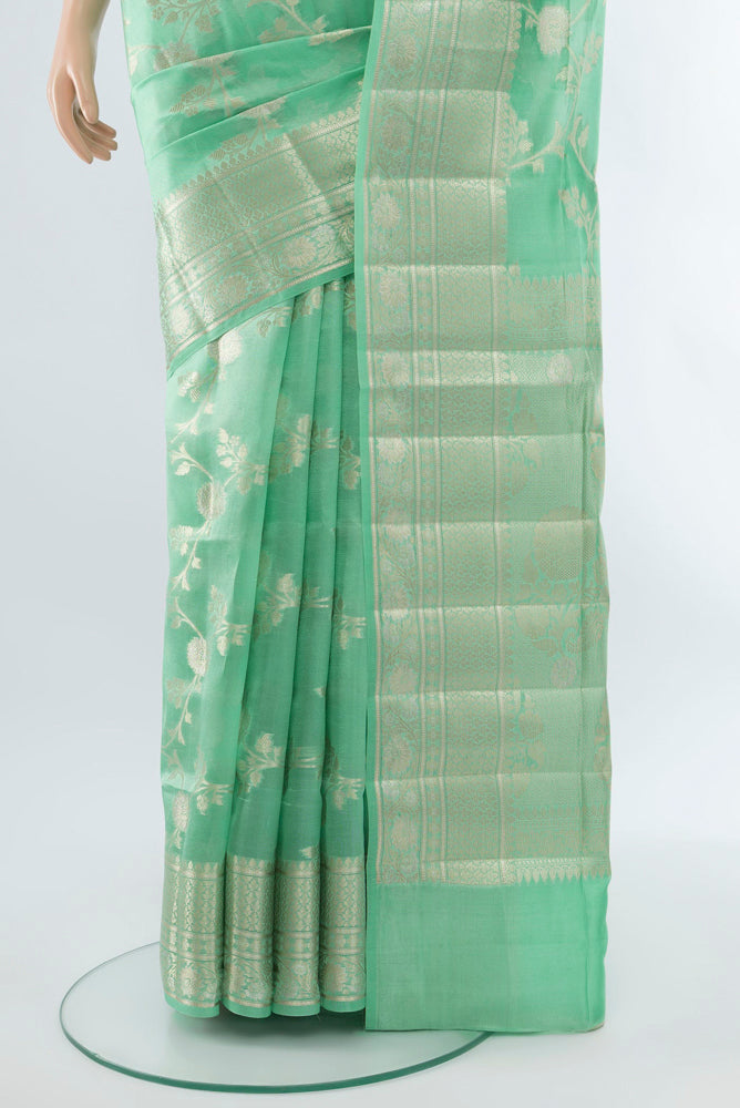 Pleats and pallu of Light Green Banarasi Raw Silk Saree with Zari Butta on the body and Silk Border. 