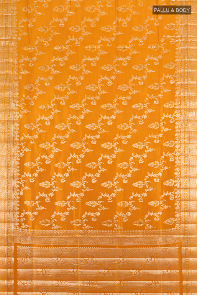 Flat view of Mustard Banarasi Raw Silk Saree with Zari Butta on the body and Silk Border. 
