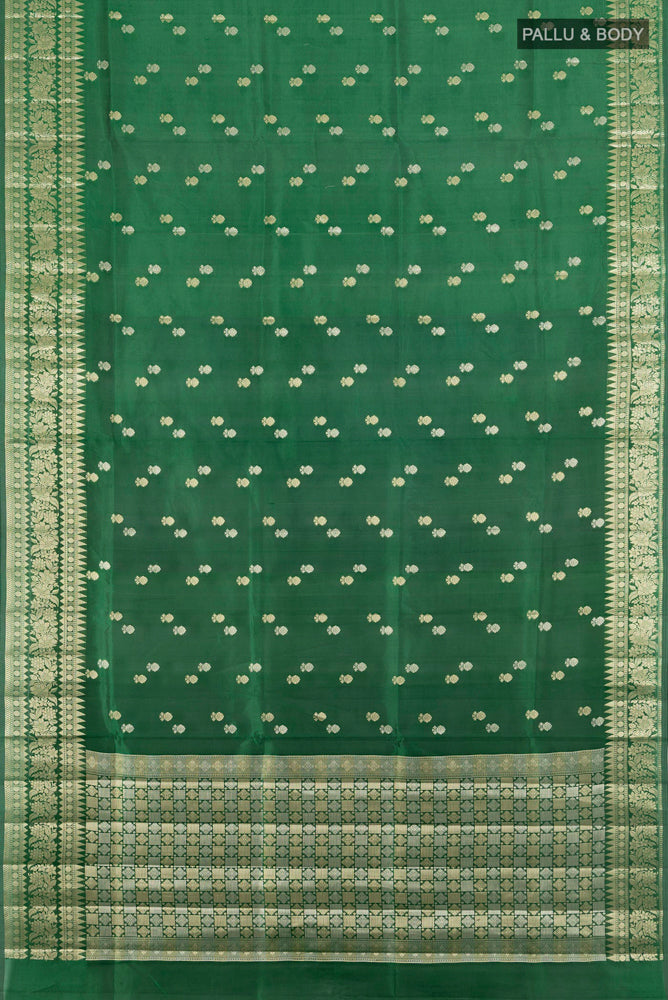 Flat view of Bottle Green Banarasi Raw Silk Saree with Zari Butta on the body and Silk Border. 