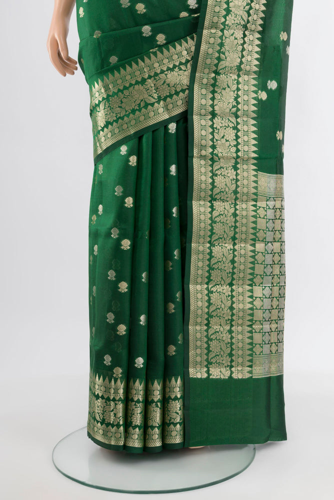 Pleats and pallu of Bottle Green Banarasi Raw Silk Saree with Zari Butta on the body and Silk Border. 