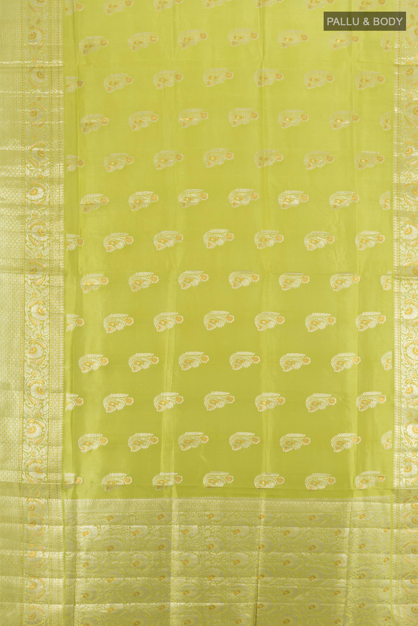 Flat view of Pista Green Banarasi Raw Silk Saree with Zari Butta on the body and Silk Border. 