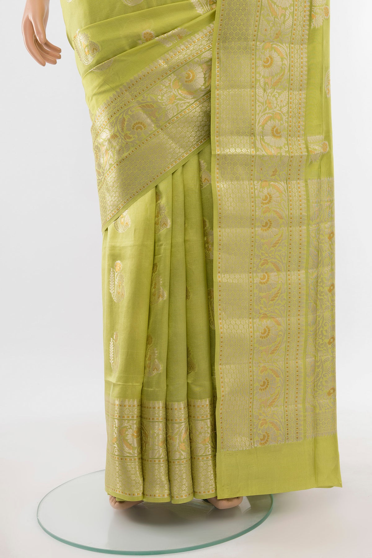 Pleats and pallu of Pista Green Banarasi Raw Silk Saree with Zari Butta on the body and Silk Border. 