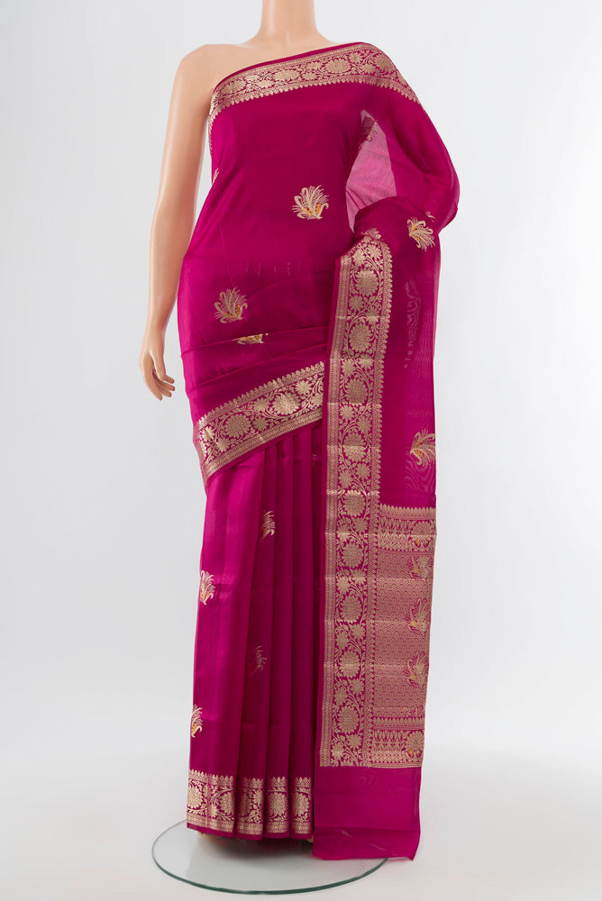 Purple Banarasi Raw Silk Saree with Zari Butta on the body and Silk Border.  displayed on a mannequin