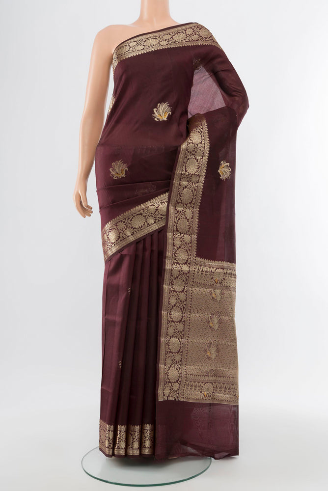 Coffee Brown Banarasi Raw Silk Saree with Zari Butta on the body and Silk Border.  displayed on a mannequin