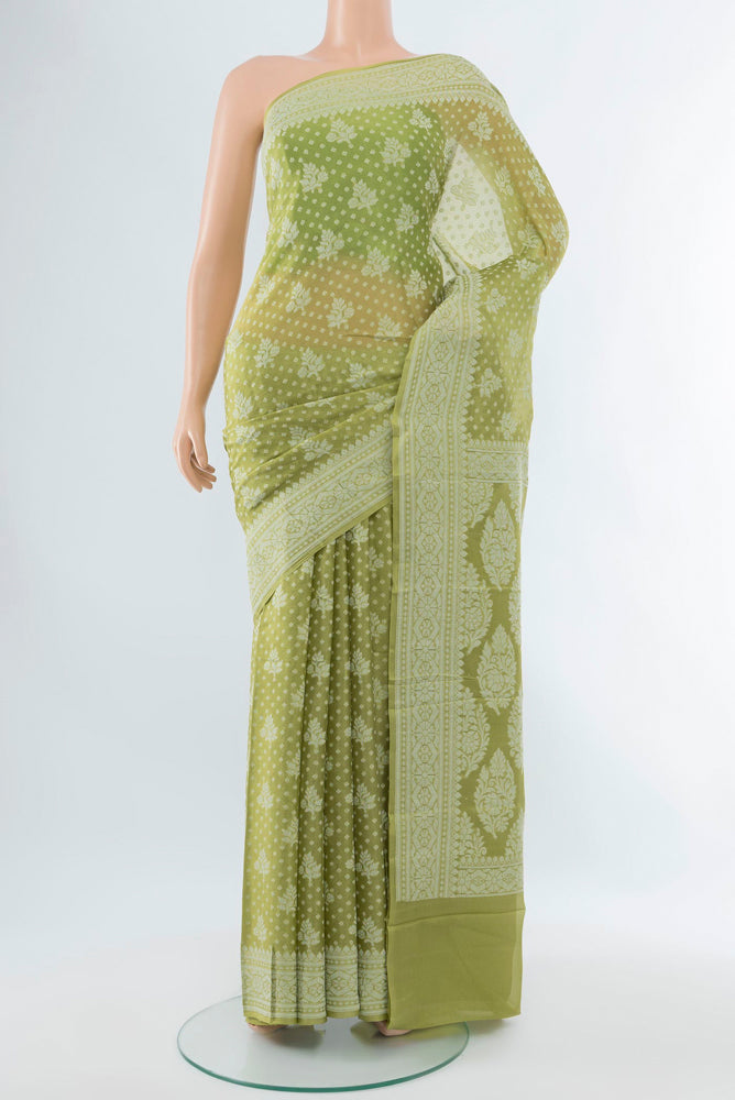 Pista Green Banarasi Georgette Saree with Jacquard With Thread Butta on the body and Silk Border.  displayed on a mannequin